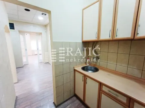 Smaller kitchen within the apartment with wooden elements. - image 7