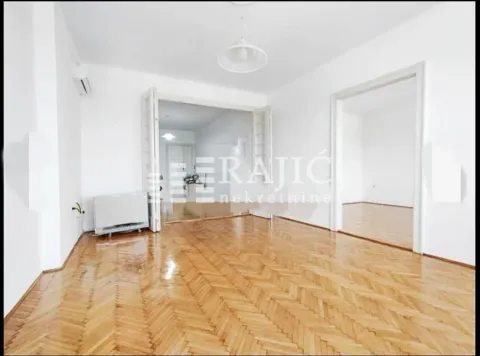 Empty room with wooden parquet flooring and white walls. - image 17