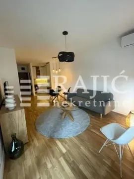 Living room with sofa and dining area. - image 8