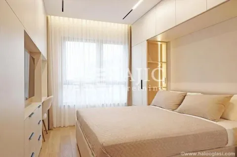 Modern bedroom with built-in closets and a double bed. - image 9