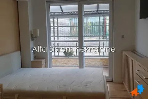 Furnished bedroom with a double bed and access to the terrace. - image 12