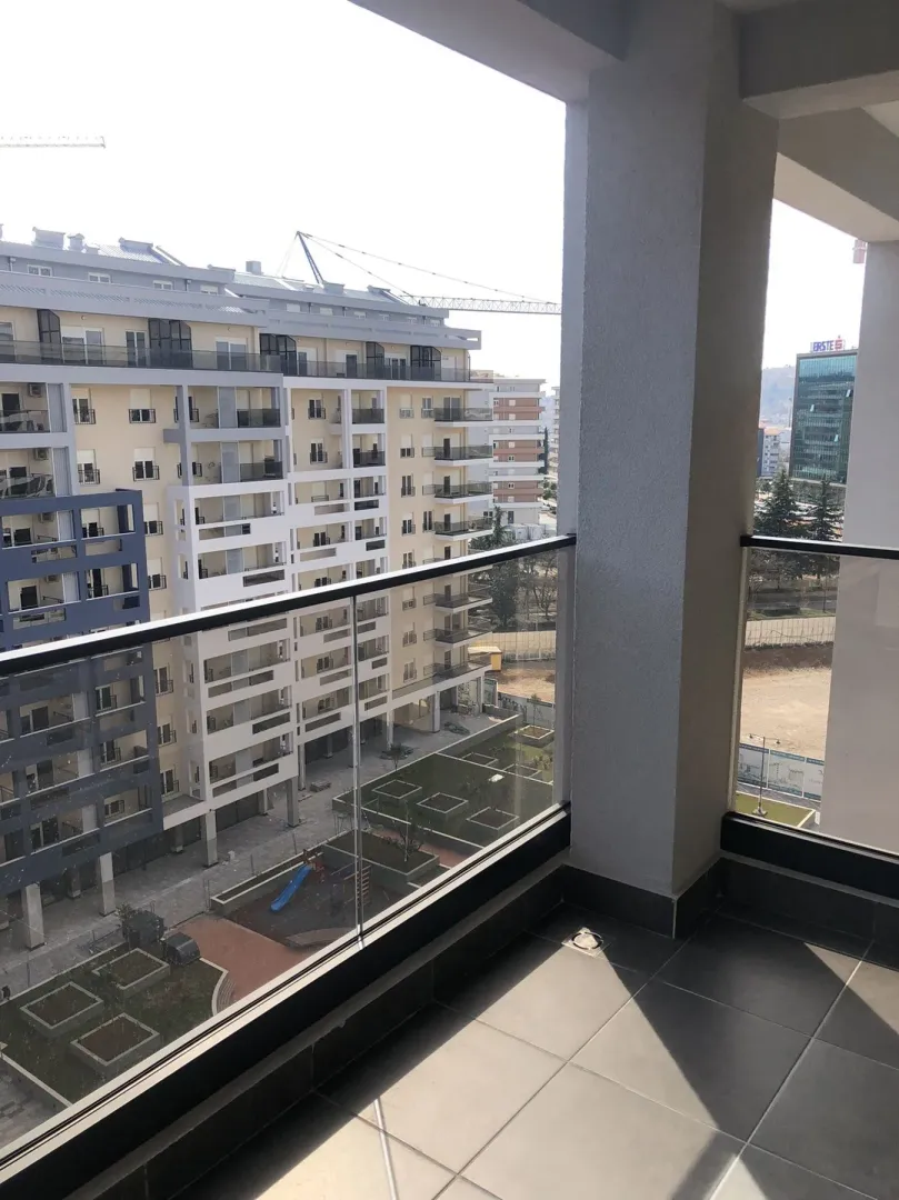 View from a spacious balcony overlooking neighboring residential buildings.