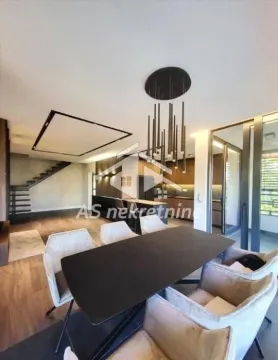 Living room with dining area and staircase. - image 18