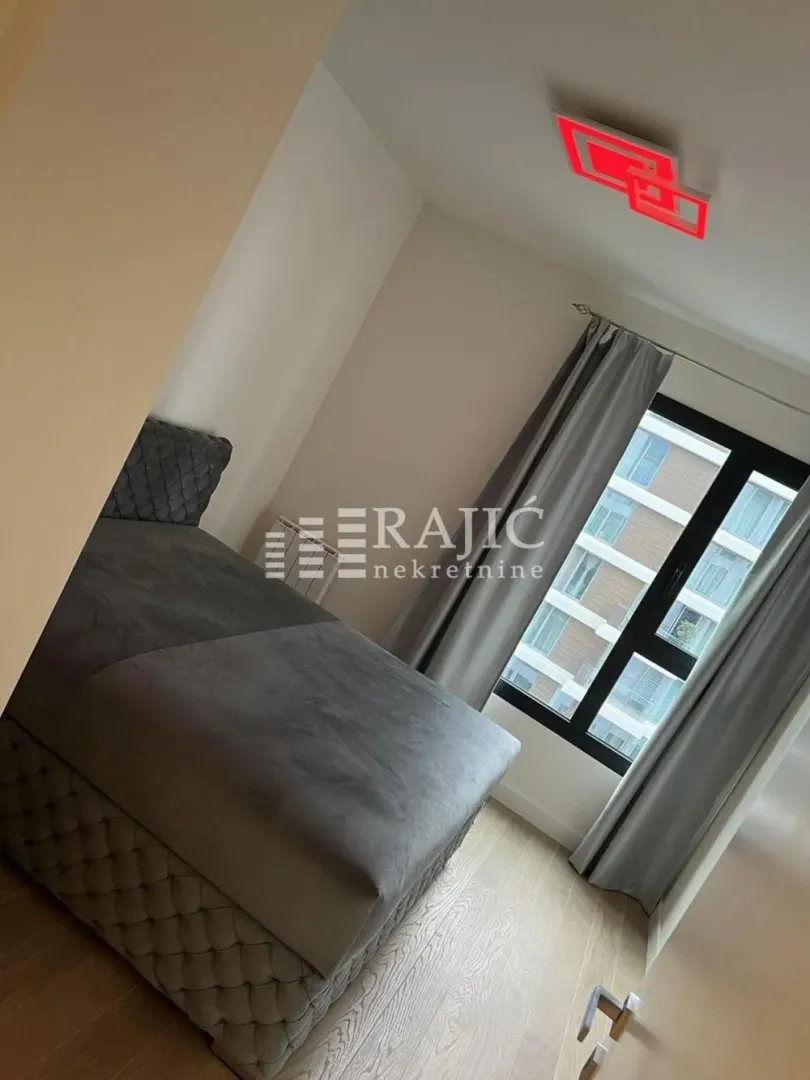 Furnished bedroom with a double bed.