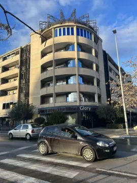 Exterior view of a modern residential building with a semi-circular facade. - image 12