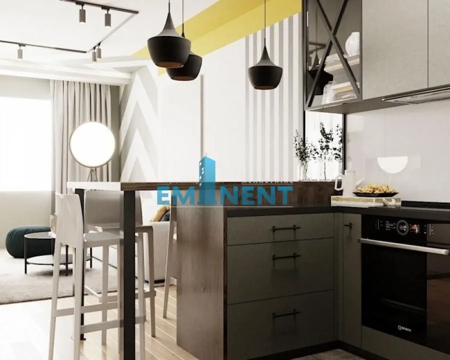 Modern kitchen with a breakfast bar and built-in units open to the living room.