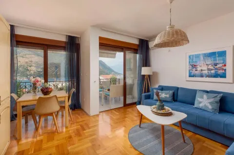 Bright living room with a dining area and access to a terrace with a sea view. - image 4