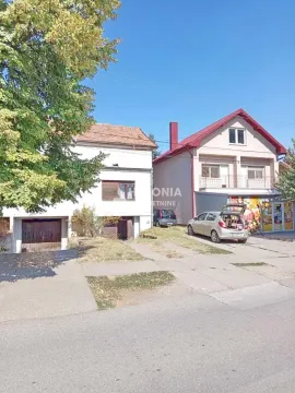 Exterior view of the house with yard and parked cars. - image 10