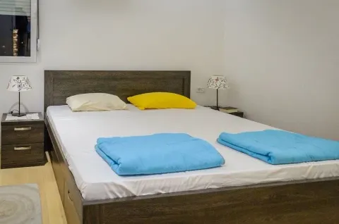 Bedroom with a double bed and nightstands. - image 6