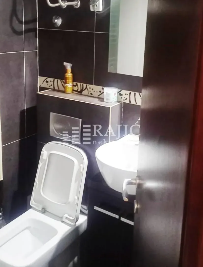 A view of a modern bathroom with sanitary fixtures.