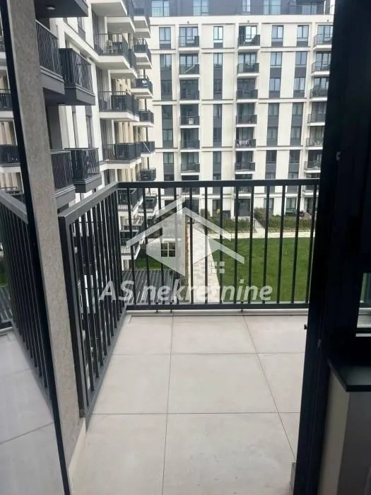 View from the balcony overlooking the courtyard and the adjacent building.