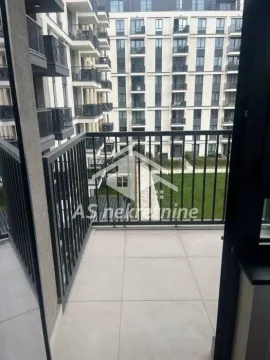 View from the balcony overlooking the courtyard and the adjacent building. - image 12