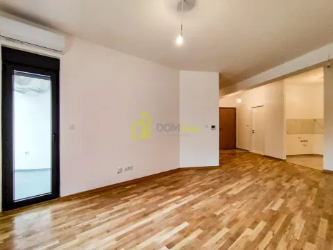 Spacious empty living room with hardwood floors and access to the terrace. - image 12