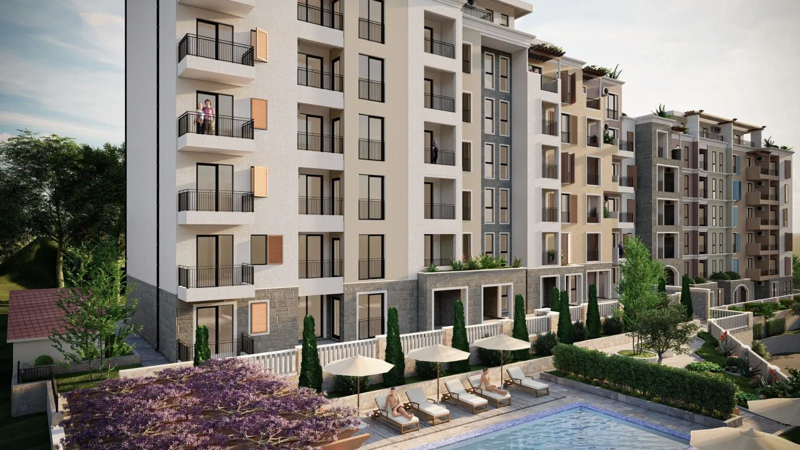 Exterior view of an apartment building with a swimming pool and landscaped yard.