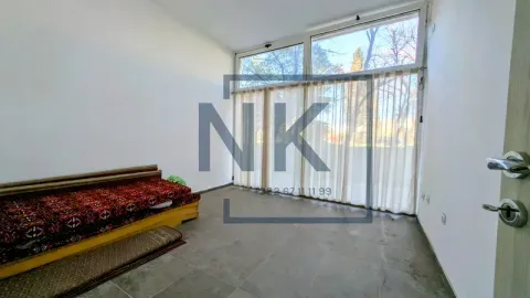 Living room with large windows and a sofa. - image 2