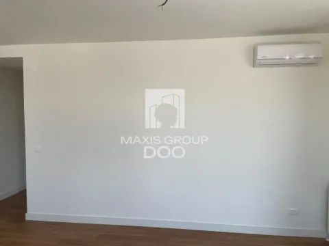 Empty room with white walls, wooden flooring, and an air conditioning unit. - image 3