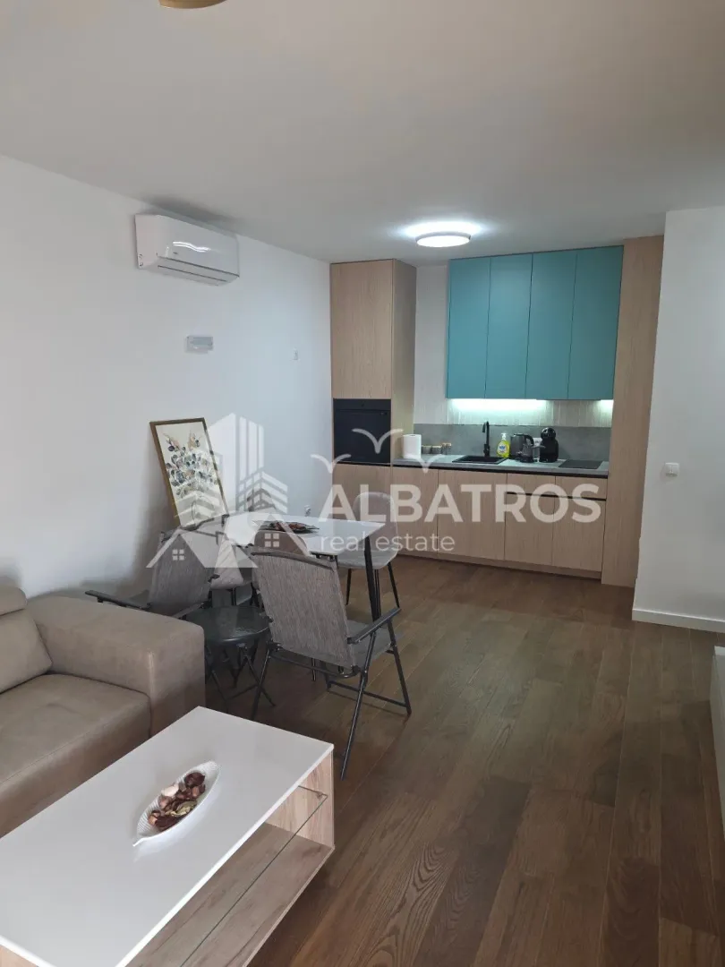 Living room with dining area and kitchen.