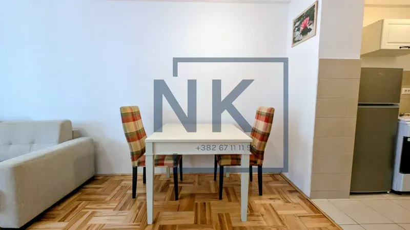 Living room with a dining table and chairs.