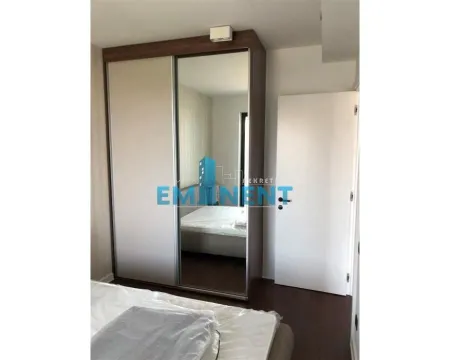 Bedroom with a large fitted wardrobe with sliding doors and a mirror. - image 8