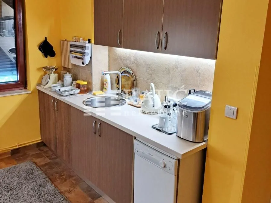 View of a part of the kitchen with cabinets and a sink.