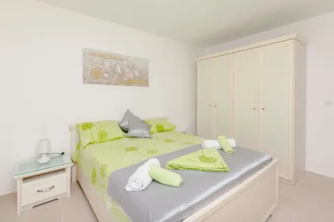Bright bedroom with a double bed, wardrobe, and decorative details. - image 8