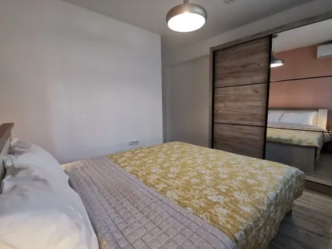 Bedroom with a double bed and a large mirrored wardrobe. - image 5