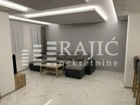 Modern and bright living room with a sofa and dropped ceiling. - image 3