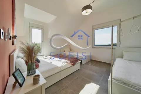 Bright and spacious bedroom with multiple beds and windows. - image 15