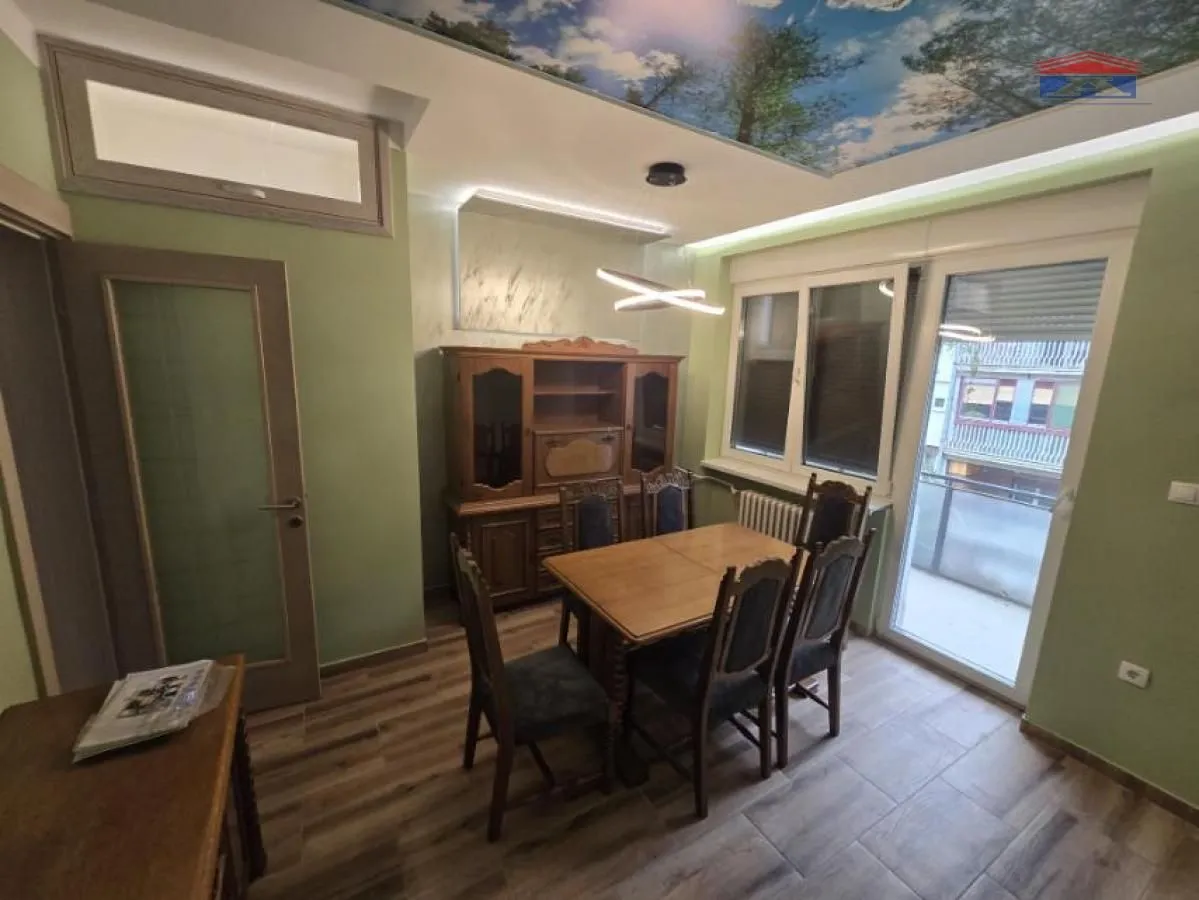 Living room with a dining table and chairs.