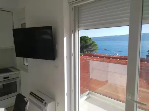 Living room with sea view and terrace access. - image 5