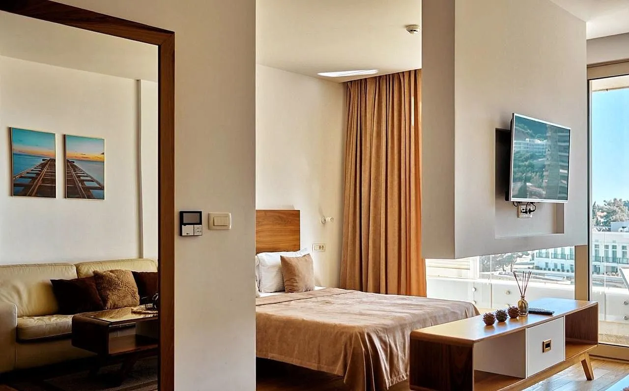 Modern bedroom with a double bed and a view of the terrace.
