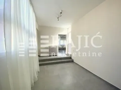 Bright empty room with white walls and tiled flooring. - image 13