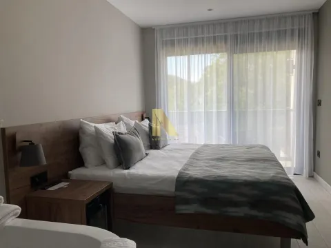 Modern bedroom with a double bed and access to the terrace. - image 2