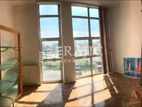 Bright room with large windows and parquet flooring. - image 5