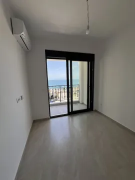 Empty room with a balcony and a sea view. - image 2