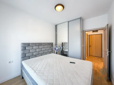 Bedroom with a double bed, wardrobe, and an open door leading to the hallway. - image 6