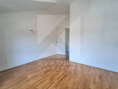 Empty room with hardwood flooring and white walls. - image 18