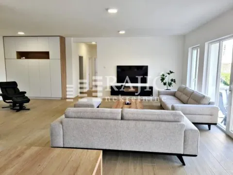 Spacious and bright living room with seating set and TV. - image 10
