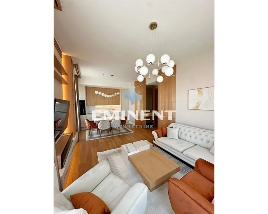 Spacious living room connected to the dining area with modern furniture.