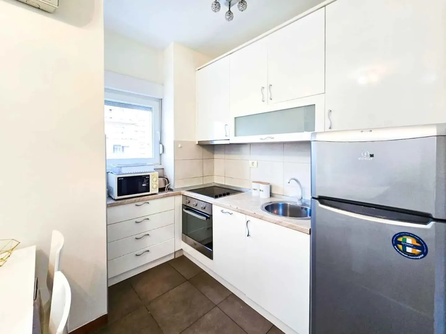 Bright kitchen with white cabinets.