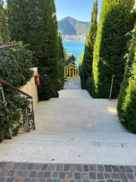 Staircase surrounded by cypress trees with a sea view. - image 9