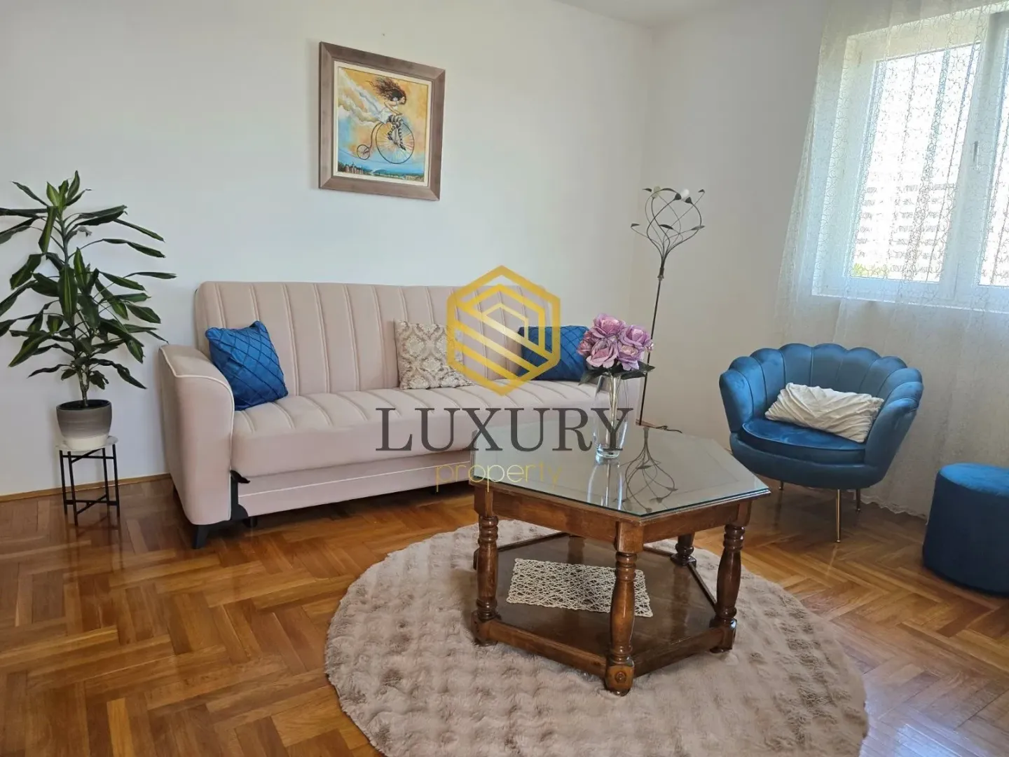 Living room with a sofa, armchair, and coffee table.