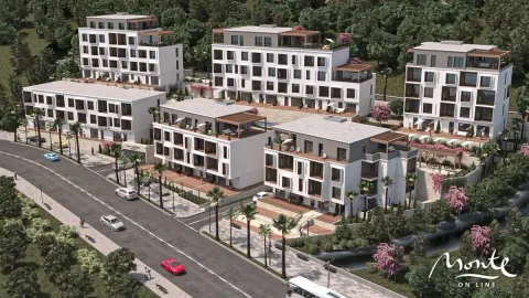 Pogled iz vazduha na kompleks modernih stambenih zgrada sa uređenom okolinom. - image 3
