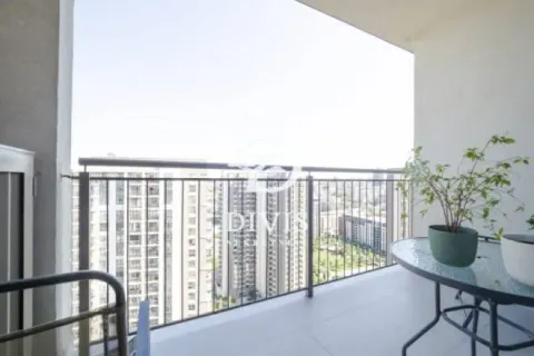 Furnished balcony with a table and a view of surrounding buildings. - image 13