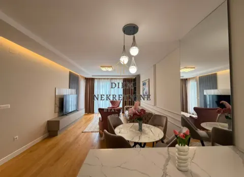 Modern living room with a dining area and dropped ceiling. - image 10