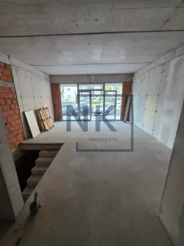Unfinished space in grey phase of construction with a staircase. - image 6
