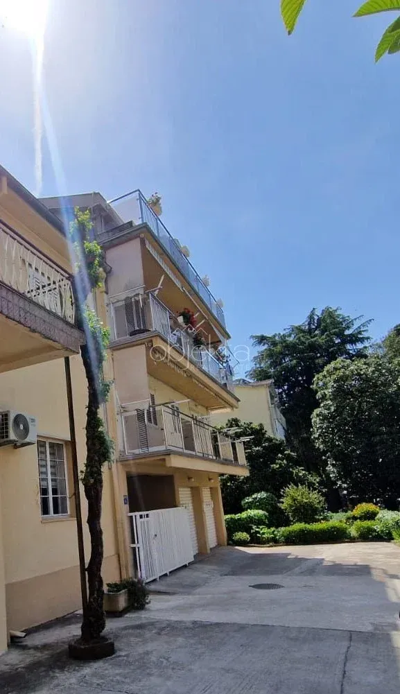 View of the exterior of the building with balconies and a courtyard.