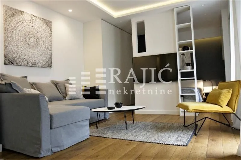 Modern and bright living room with a sofa and coffee table.