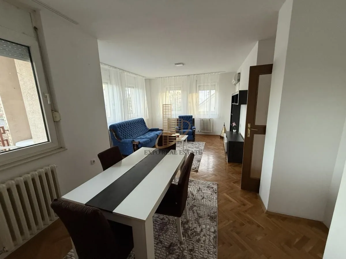Living room with a dining table and seating set.