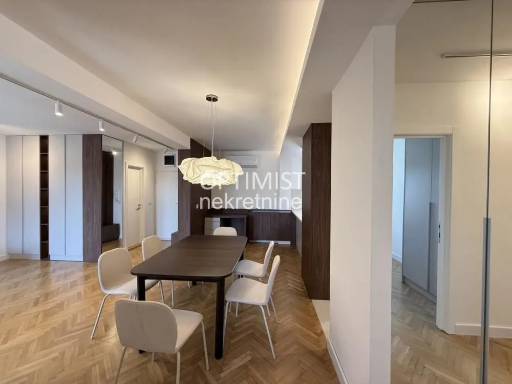 Living room with a dining area and modern furniture.
